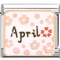 Macro view of a 9mm Italian charm link with April text and pink floral pattern - April