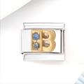 Macro-opname van roestvrijstalen bedel met gouden letter B en blauwe zirkonia steentjes - Blauw Zirkoon Letter B (3465)