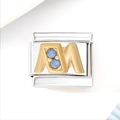 Macro detail of stainless steel charm with golden letter M and light blue crystals - Blue Zircon Letter M (3476)