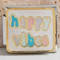 Macro shot of a stainless steel bracelet link featuring Happy Vibes text and glitter - Happy Vibes (3546)