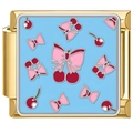 Gros plan d'une breloque en acier doré avec des nœuds roses et cerises rouges - Cerise Papillon en Or