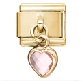 Gros plan d'un charm modulaire en acier doré avec un pendentif en cristal rose en cœur - Coeur Rose