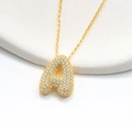 Close-up of gold bubble letter A pendant necklace with sparkling pavé cubic zirconia - 925 Silver / Gold (Initial A)