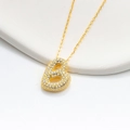 Macro shot of gold S925 silver bubble pendant with micro-pave crystals on a thin chain - 925 Silver / Gold (Initial B)