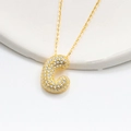 Detailed view of bubble initial C pendant with pavé cubic zirconia on gold necklace chain - 925 Silver / Gold (Letter C)