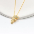 Macro detail of the gold-plated letter F bubble pendant necklace with pavé zircon - 925 Silver / Gold (Initial F)