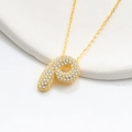 Macro shot of gold-plated puffy letter P pendant with micro-paved cubic zirconia stones - 925 Silver / Gold (Initial P)