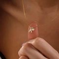 Elegant gold necklace with a zircon A-letter pendant and sparkling round crystal charm - Letter A