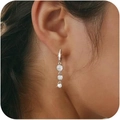 Elegant silver drop earrings with three round cubic zirconia stones on female model - Triple Round Zircon (Style 3 Silver)