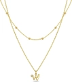Detail of gold double-layer necklace featuring a letter W pendant and inlaid crystal - Letter W