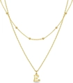 Double layered gold necklace featuring a beaded chain and a paved letter E pendant - Letter E