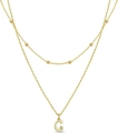 Double-layered golden necklace featuring beaded chain and letter G pendant with small zircon - Letter G