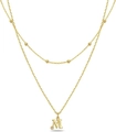 Layered gold satellite chain necklace featuring a crystal-accented letter M pendant - Letter M