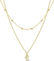 Double-layered golden necklace with letter R pendant and small pave set crystal stones - Letter R