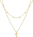 Layered gold beaded necklace featuring a sparkling crystal-encrusted letter T pendant - Letter T