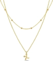 Gold layered beaded necklace featuring a cursive X pendant with sparkling clear stone - Letter X