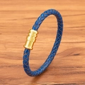 Braided blue leather bracelet featuring a tiered gold cylindrical magnetic clasp - Blue Leather Gold Clasp