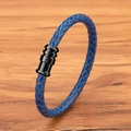 Blue braided leather bracelet with black textured magnetic clasp on wooden background - Blue Leather Black Clasp