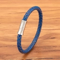 Braided blue leather bracelet with silver cylindrical magnetic clasp on wood - Blue Leather Steel Buckle