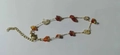 Detail of irregular natural red agate stone beads and gold chain bracelet with lobster clasp - Agate Stone Bracelet