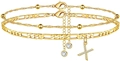 Detail von zweilagigen Goldketten mit einer Zirkonia-Perle und funkelndem Kreuzanhänger - Buchstabe X
