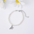 Elegant pearl bracelet with a micro-pave zircon letter F pendant and adjustable chain - Letter F / Silver
