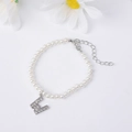 Elegant pearl bracelet featuring a silver letter E charm with sparkling cubic zirconia - Letter W / Silver