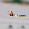 Detail of elegant gold drop earrings with marquise-cut red gemstone and sleek long pendant - Natural Rose Garnet / Rose Red Garnet