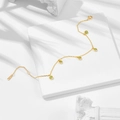 Elegant S925 silver gold-plated bracelet with five round green gemstones on marble surface - 925 Silver / Peridot Bracelet