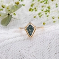 Detailed macro view of kite-cut moss agate ring with gold band and sparkling accent stones - US Size 5 / Gold Style