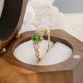 Detailed macro of vintage gold ring with oval green stone in a wooden gift box - US Size 6 / Diopside Ring (Gold)