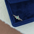 Macro shot of gold opal ring with blue-green fire and four white accent stones - Natural Australian Opal Ring Size 5 / 925 Silver