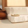 Macro detail of two gold eternity rings featuring pave set white cubic zirconia stones - 10# / Gold