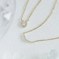 Macro view of gold U-shaped horseshoe pendant and curved diamond necklace set - 925 Silver / Gold Horseshoe Necklace