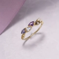 Macro shot of kite-cut gemstones on gold-plated ring with elegant milgrain side details - US 5 / Multicolor