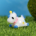Miniature blue and white unicorn figurine lying on green grass for micro landscape decor - Blue