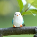 Miniature resin bird figurine featuring white body and blue wings for garden decor - Pink Flamingo