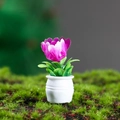 Miniature dollhouse plant with purple and white flowers in a small white round pot - Purple