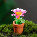 Miniature dollhouse potted plant with pink flower and green leaves in brown pot - Pink And White Daisy