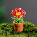 Miniature dollhouse potted plant with red flowers in a tiny clay pot for garden decor - Red Petal Daisy