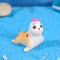 Miniature resin seal figurine with red dots and pink hat for micro landscapes - Orange Spotted Sea Lion Mother / White