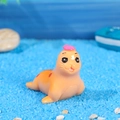 Mini resin seal figurine with pink hat and red spots for ocean micro landscapes - Sea Lion Mother / Deep Yellow