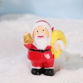 Miniature Santa Claus resin figurine holding a golden bell and a yellow gift bag - Santa Claus with Bell (No. 4)