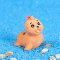 Miniature resin seal figurine in orange with pink bow for micro landscape decor - Sea Lion Daughter / Deep Yellow
