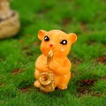 Miniature orange hamster resin figurine playing a golden saxophone for micro landscapes - Hamster with Saxophone