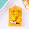 Resin fridge magnet featuring miniature yellow lemon slices on a wooden cutting board - No Magnet / Kiwi Cutting Board