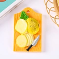 3D resin fridge magnet featuring a cutting board with potato slices and a small knife - No Magnet / Potato Cutting Board