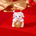 Miniature white resin dog figurine wearing a Christmas hat holding a golden horseshoe - Christmas Hat Rabbit with Horseshoe