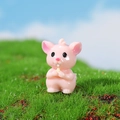 Miniature pink resin hamster figurine holding a yellow grain for succulent micro landscapes - Buck-toothed Mouse