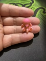 Miniature pink octopus figurine for aquarium decor displayed on a fingertip - Mini Pink Octopus (No. 11)